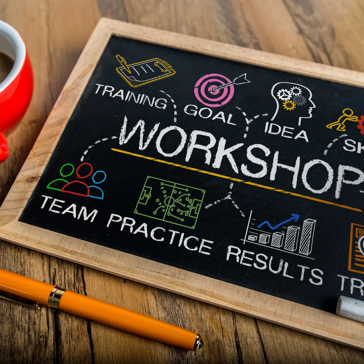 Workshop chalkboard: training, goal, idea, team, practice, results